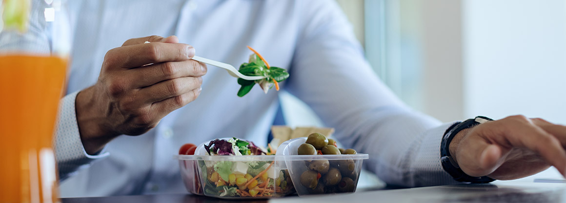 Person eating salad