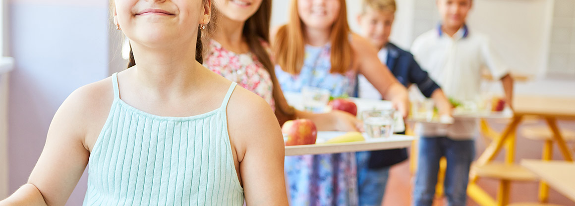 kids carrying food trays