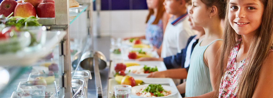 Kids getting food in cafeteria