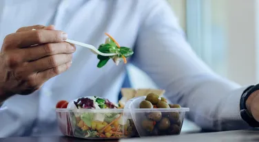 Person eating salad