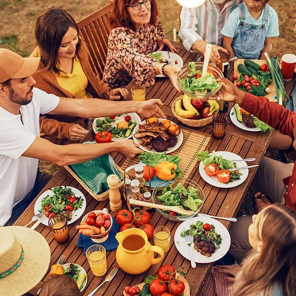 People eating food around the table