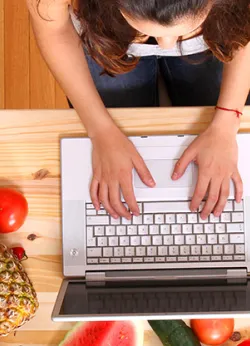 person typing on computer